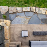 Aerial view of custom stonework in a modern residential landscape at Georgetown Lake, Montana