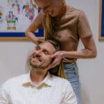 Brand photography capturing a chiropractic adjustment in progress at a clinic in Butte, Montana.