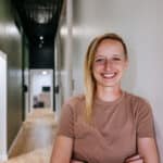 Professional brand portrait of a chiropractor photographed inside a clinic in Butte, Montana.