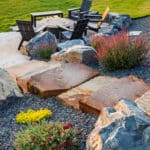Sunset view of stone landscape steps at a modern residential property in Montana