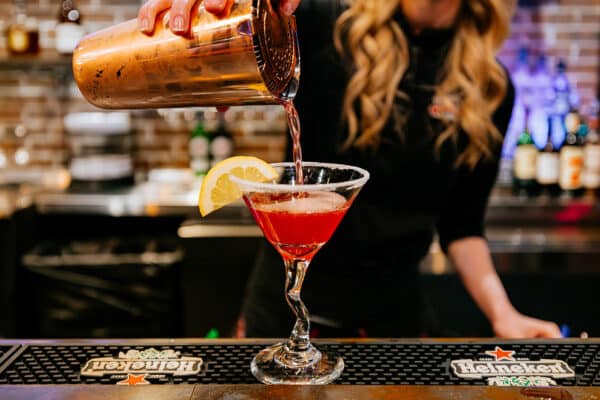 Bartender pouring refreshing looking cocktail at Gold Mine bar in Butte, Montana